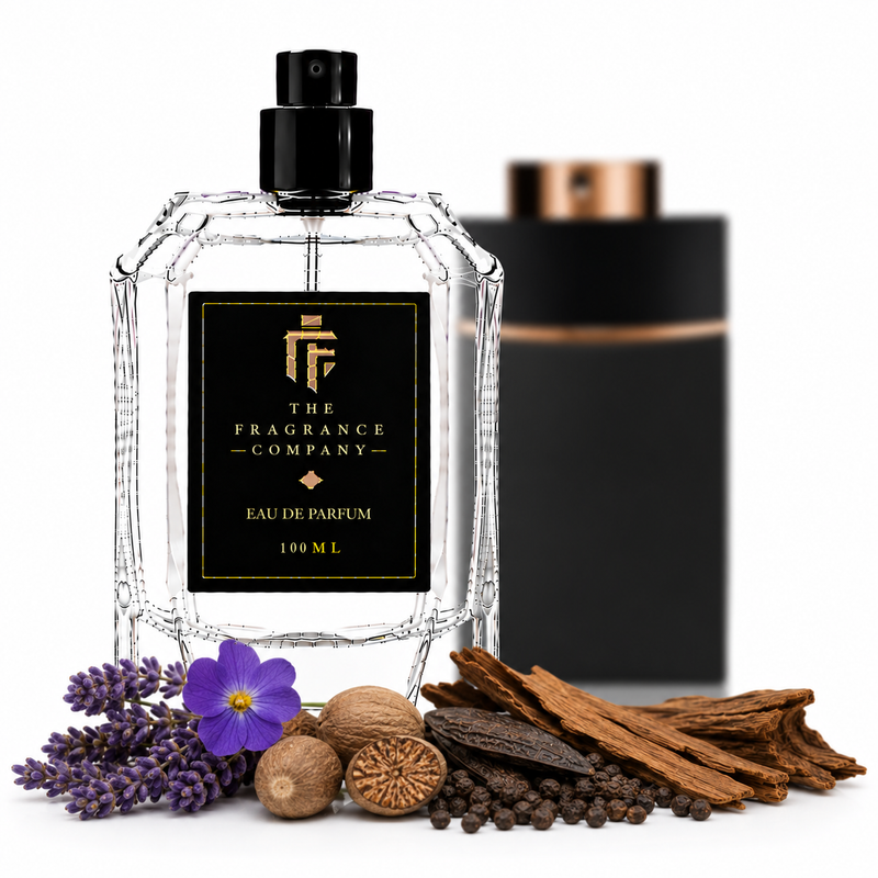 A clear glass perfume bottle with a black spray top and black label reading 'The Fragrance Company Eau De Parfum 100 ML' is centered on a white background, with decorative botanicals and spices in front and a blurred black box behind it.