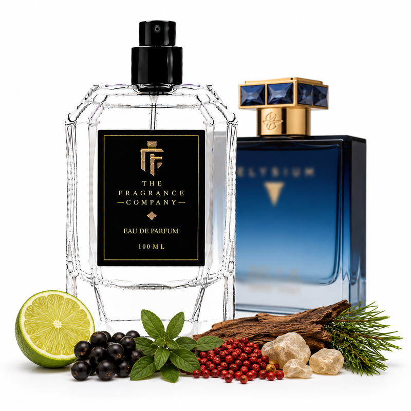 Two perfume bottles from The Fragrance Company on a white background, styled with natural ingredients. The foreground bottle is a clear faceted glass bottle with a black spray top and a black label featuring a gold logo and text.
