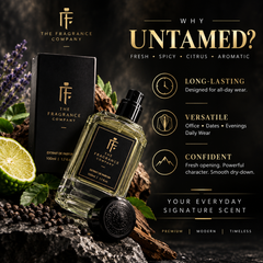 The Fragrance Company Untamed perfume bottle and box displayed on a dark rustic surface with a lime wedge, green leaves, and promotional text highlighting the scent profile and product benefits.